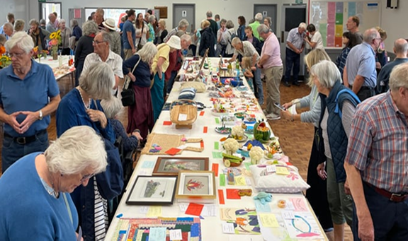 Visitors browsing stalls at a Yorkshire fayre